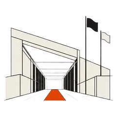 Paddock hospitality building with flags and an orange entrance